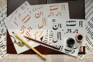 White Papers on Table with Written Calligraphy Art